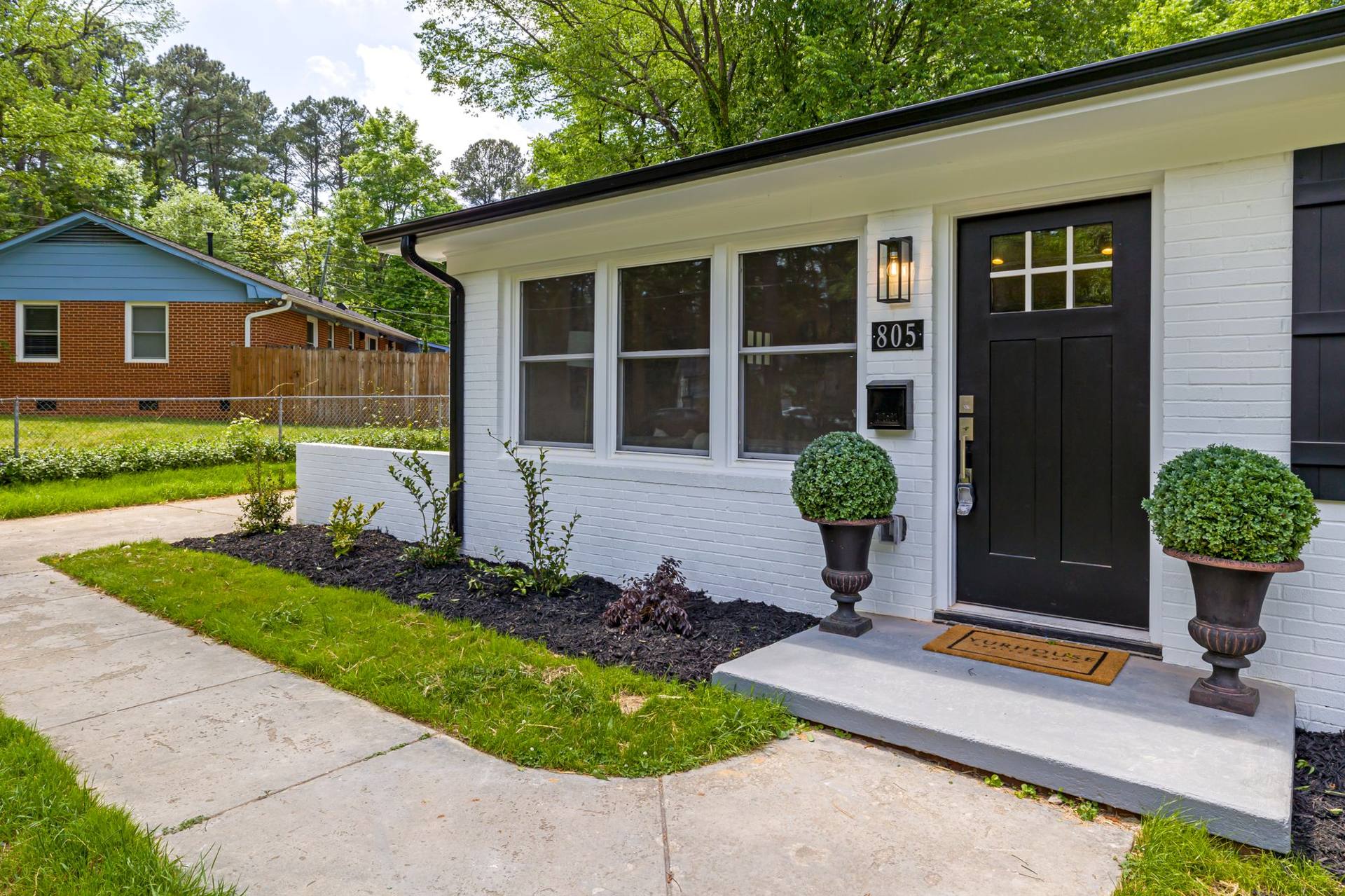 Brick family home with landscaped front yard in a Greater Cincinnati neighborhood